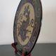 Dauphinois plate in glazed terracotta from around 1950 with dolphin decoration.