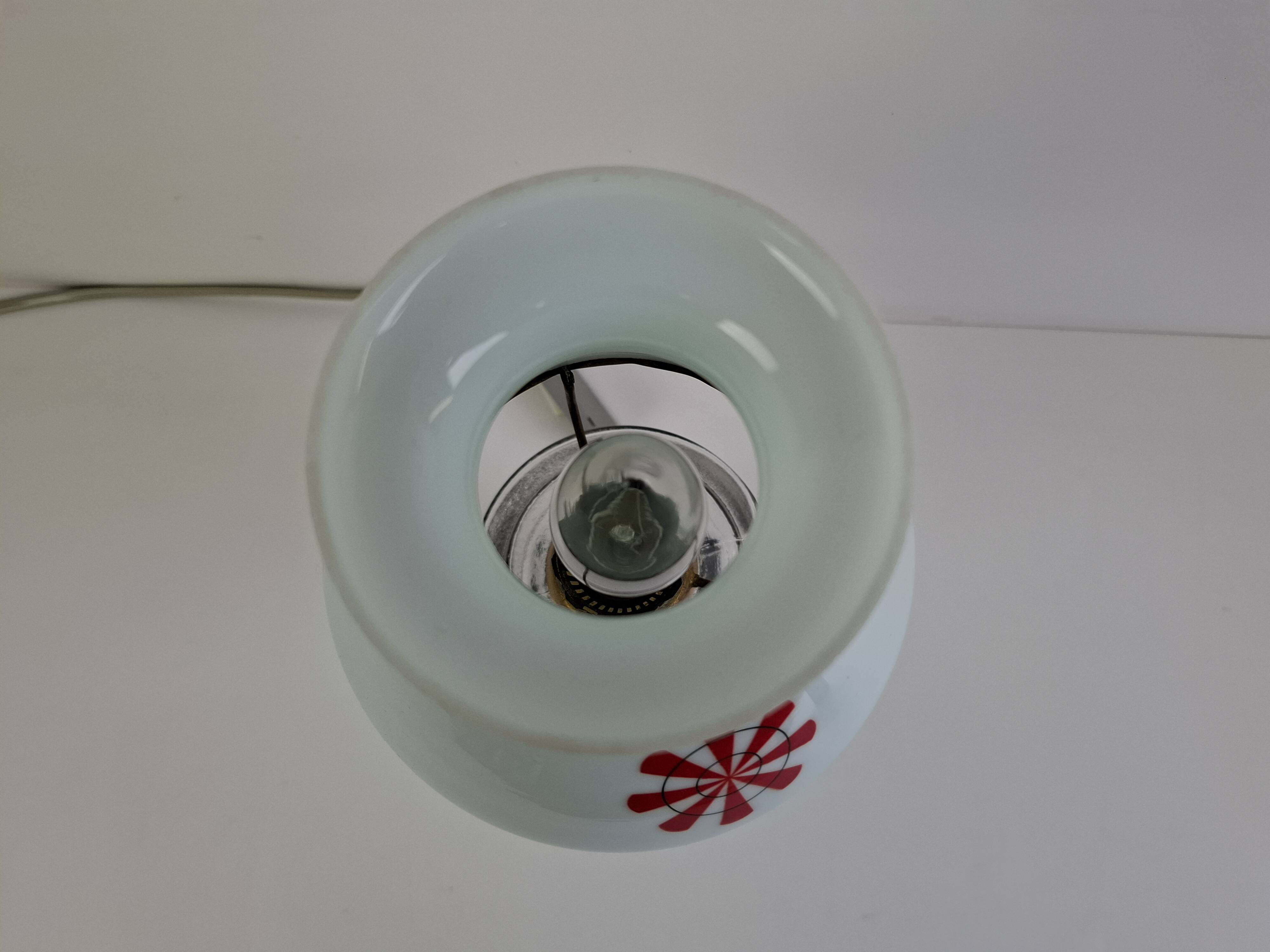 1960s Czechoslovakian milk glass oil lamp style table lamp with red windmill