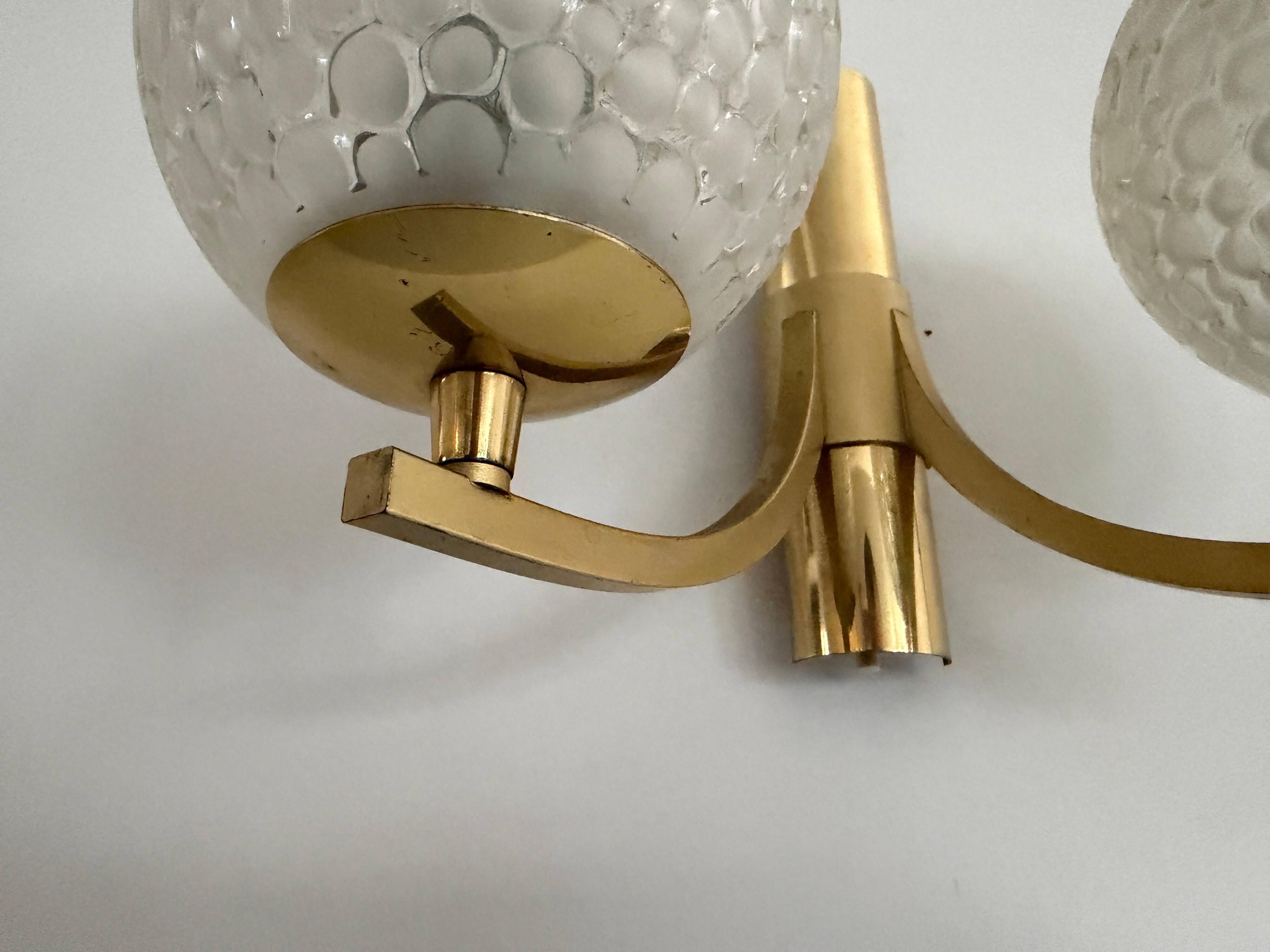 Simple two-armed wall light in brass and glass by Ball and Ball, Kaiser, 1960s, Germany.