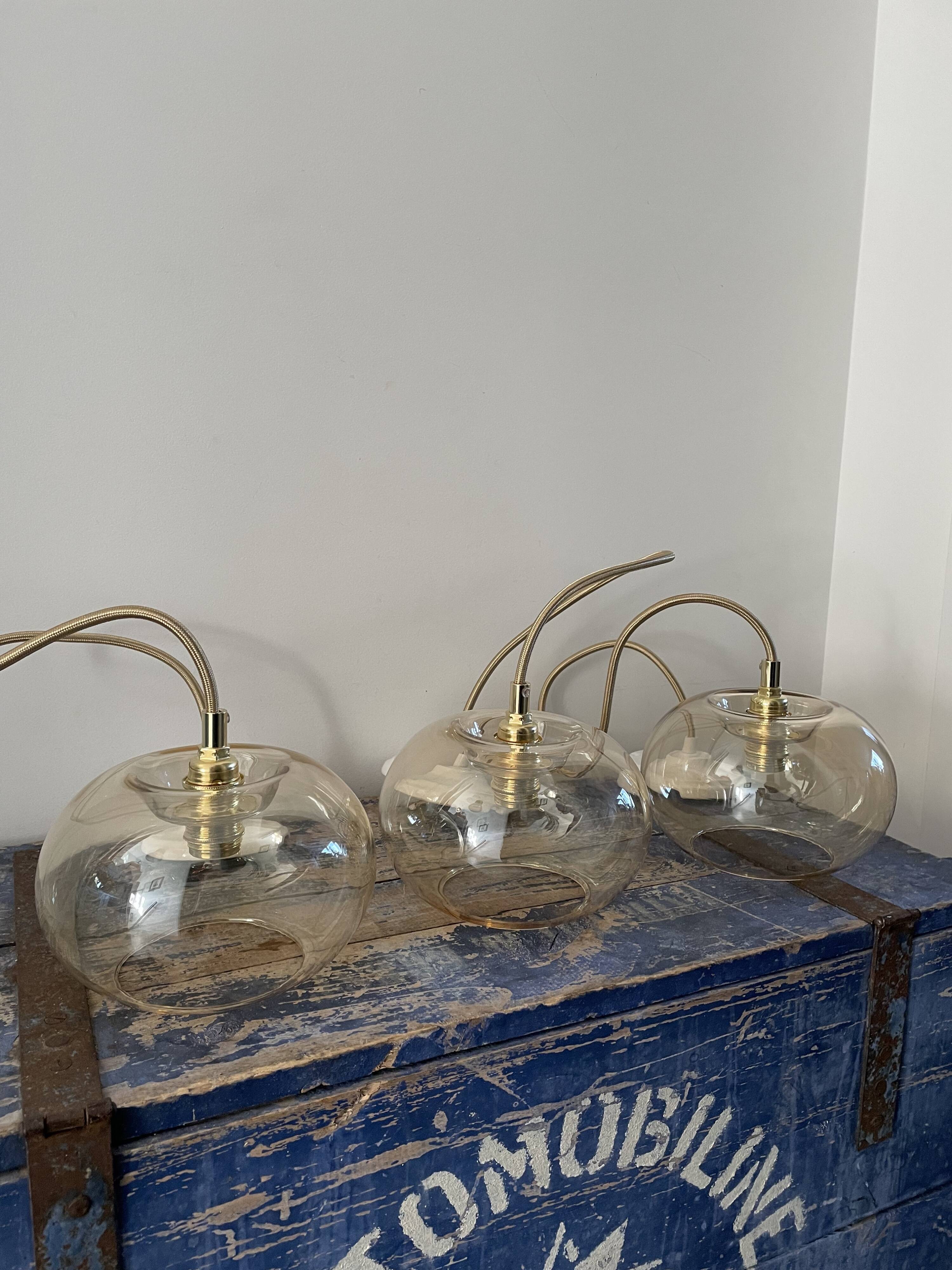 Set of three glass hanging lamps