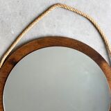 Vintage round wooden wall mirror with hooks