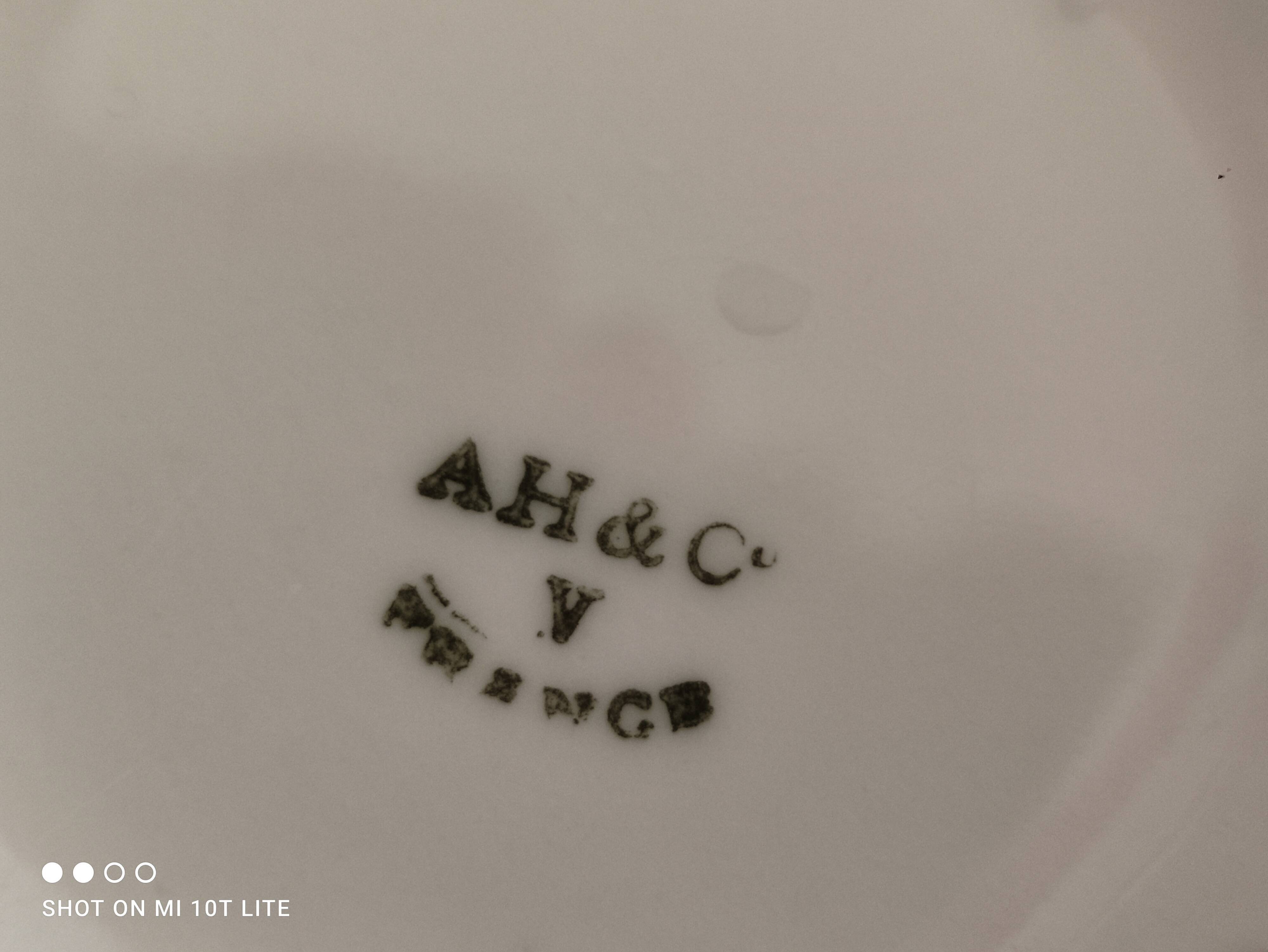 White porcelain sugar bowl decoration in relief and green and gold frieze