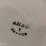 White porcelain sugar bowl decoration in relief and green and gold frieze