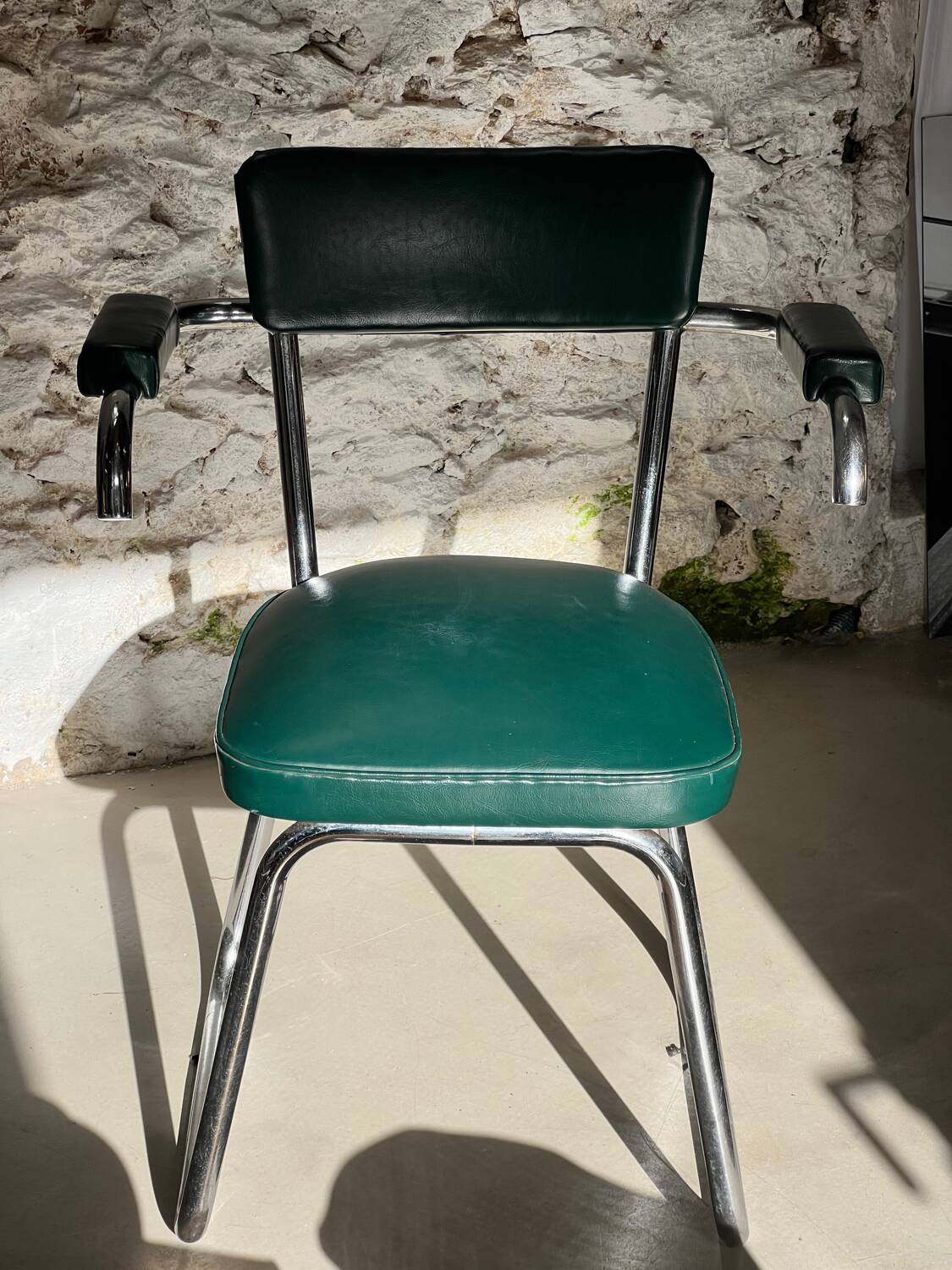 Pair of green vinyl and chrome armchairs, mid-century