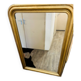 Antique gilded mirror in old Louis Philippe wood