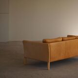 Danish Midcentury 3-seater canapé by Stouby in cognac brown leather, made in the 1970s.