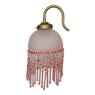 Pink glass wall lamp with garland of pearls