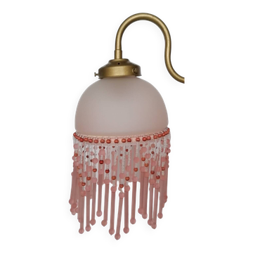 Pink glass wall lamp with garland of pearls