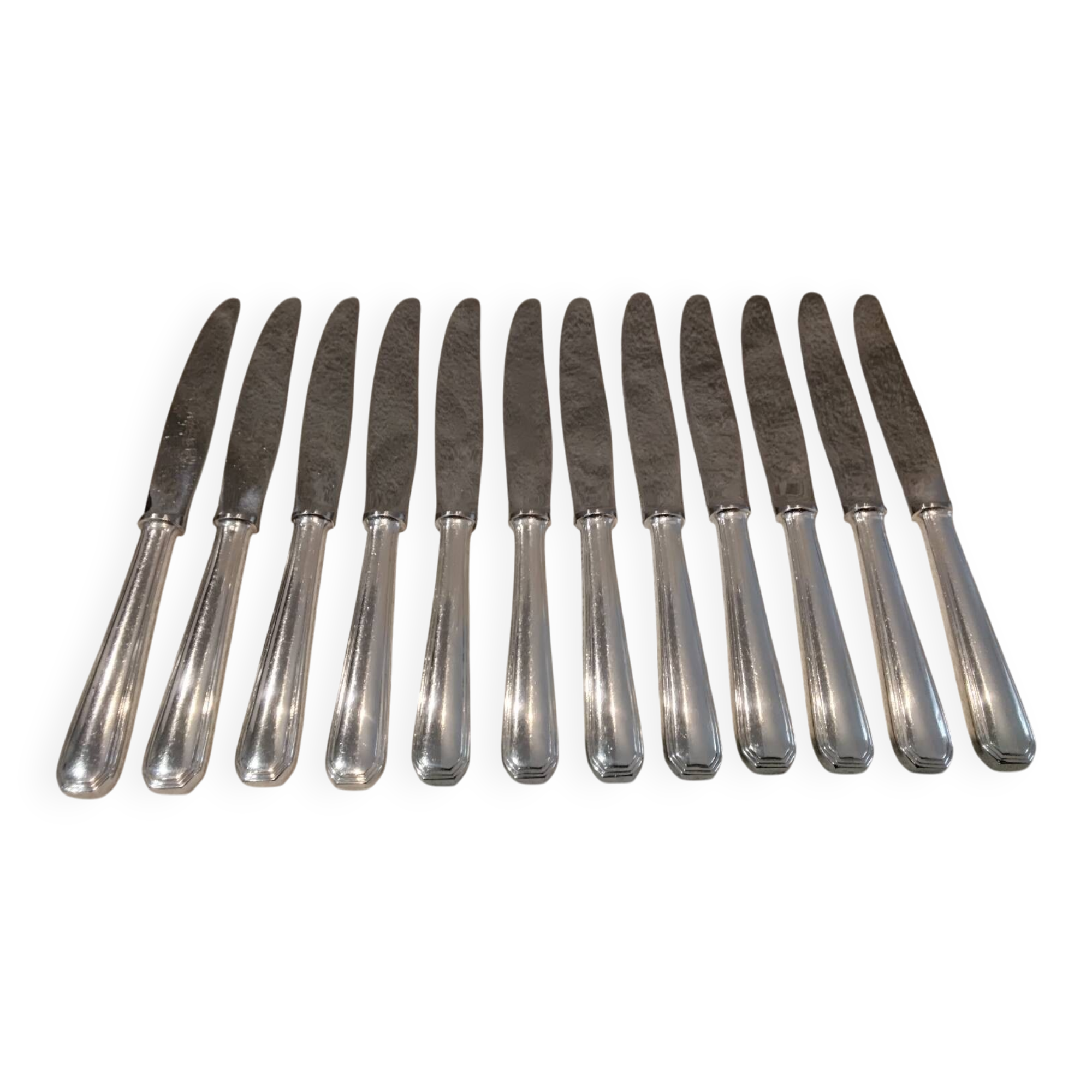 12 silver-plated table knives by Christofle America, 24.5cm