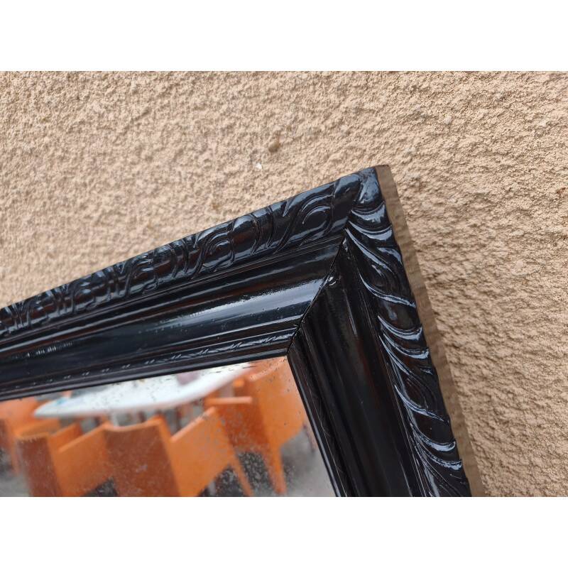 Black lacquered wood mirror "originally punctured"