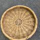 Round basket woven from straw