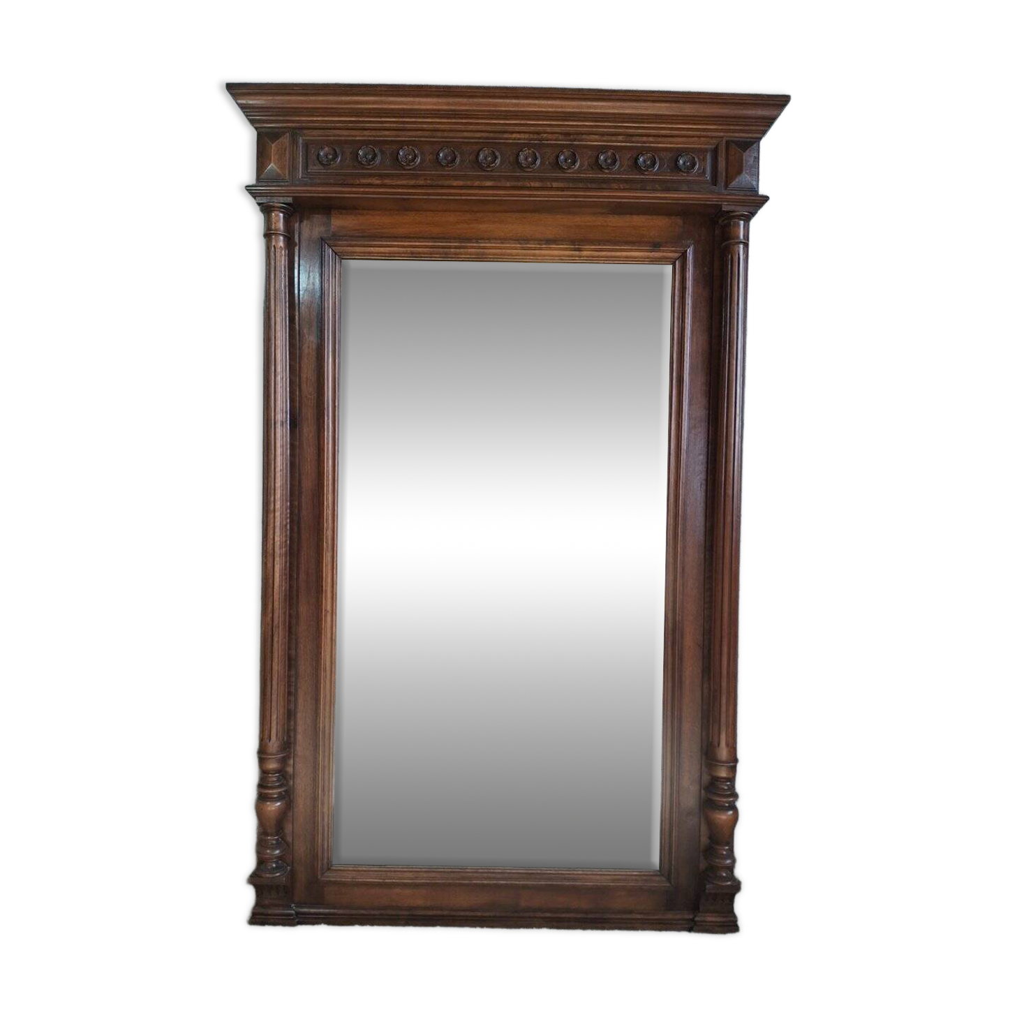 Large trumeau mirror with carved wood in the Louis XVI / Henri II style, 19th century.