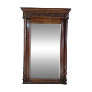 Large trumeau mirror with carved wood in the Louis XVI / Henri II style, 19th century.