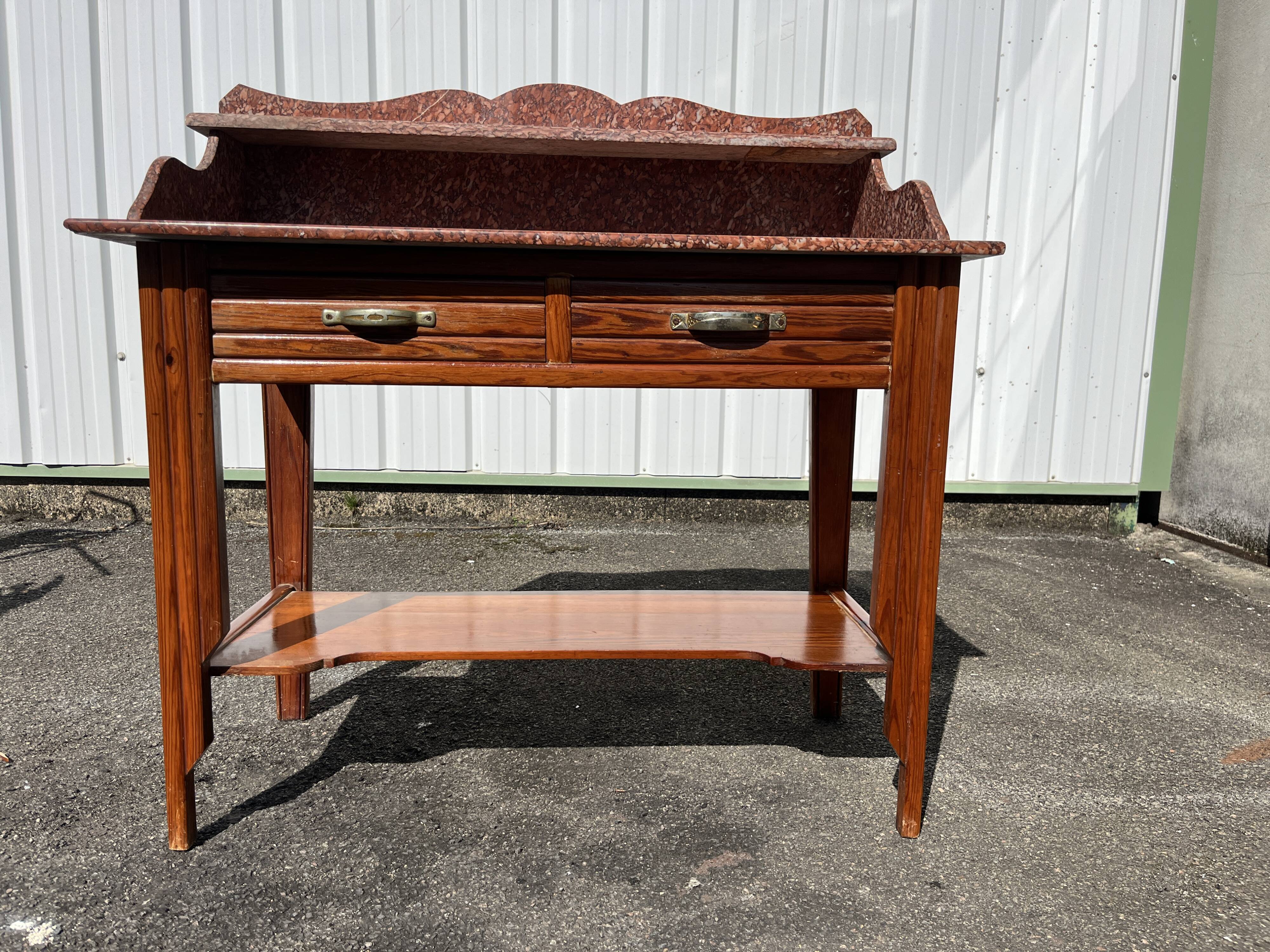 Antique wooden and red marble bathroom cabinet