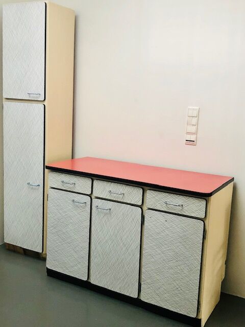 Table, chairs and kitchen furniture in red and black formica