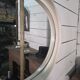 Oval mirror in white lacquer from the 1970s.