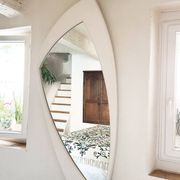 Dismantled Space Age XXL wall mirror in lacquered wood. France, 1970s.