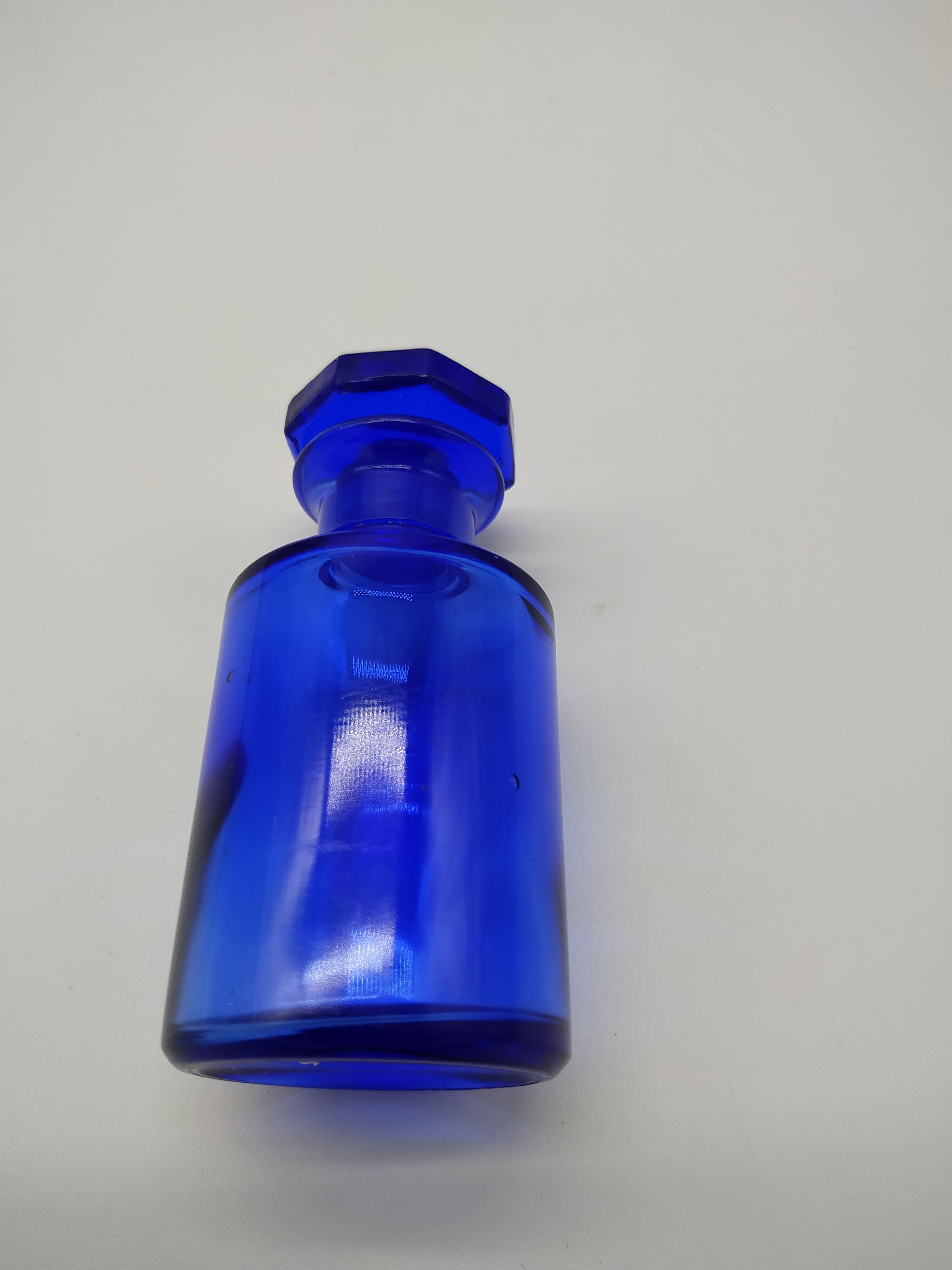 Old perfume bottle in cobalt blue glass