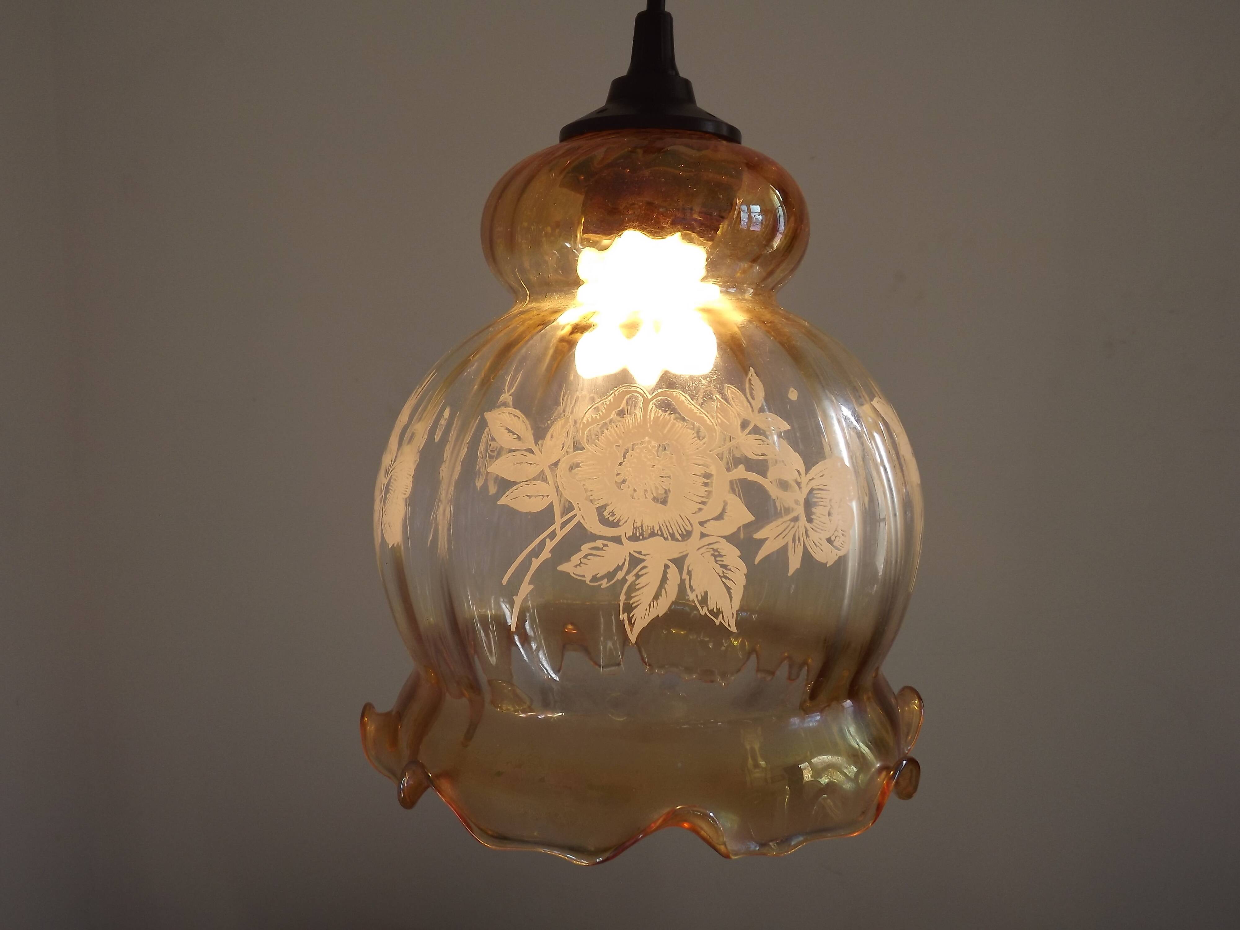 French vintage amber and clear glass ceiling light with white floral decoration.