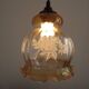 French vintage amber and clear glass ceiling light with white floral decoration.