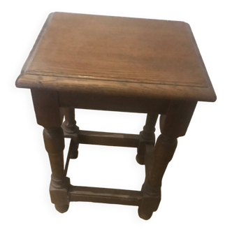 Small children's table (or coffee table) in brown varnished oak.