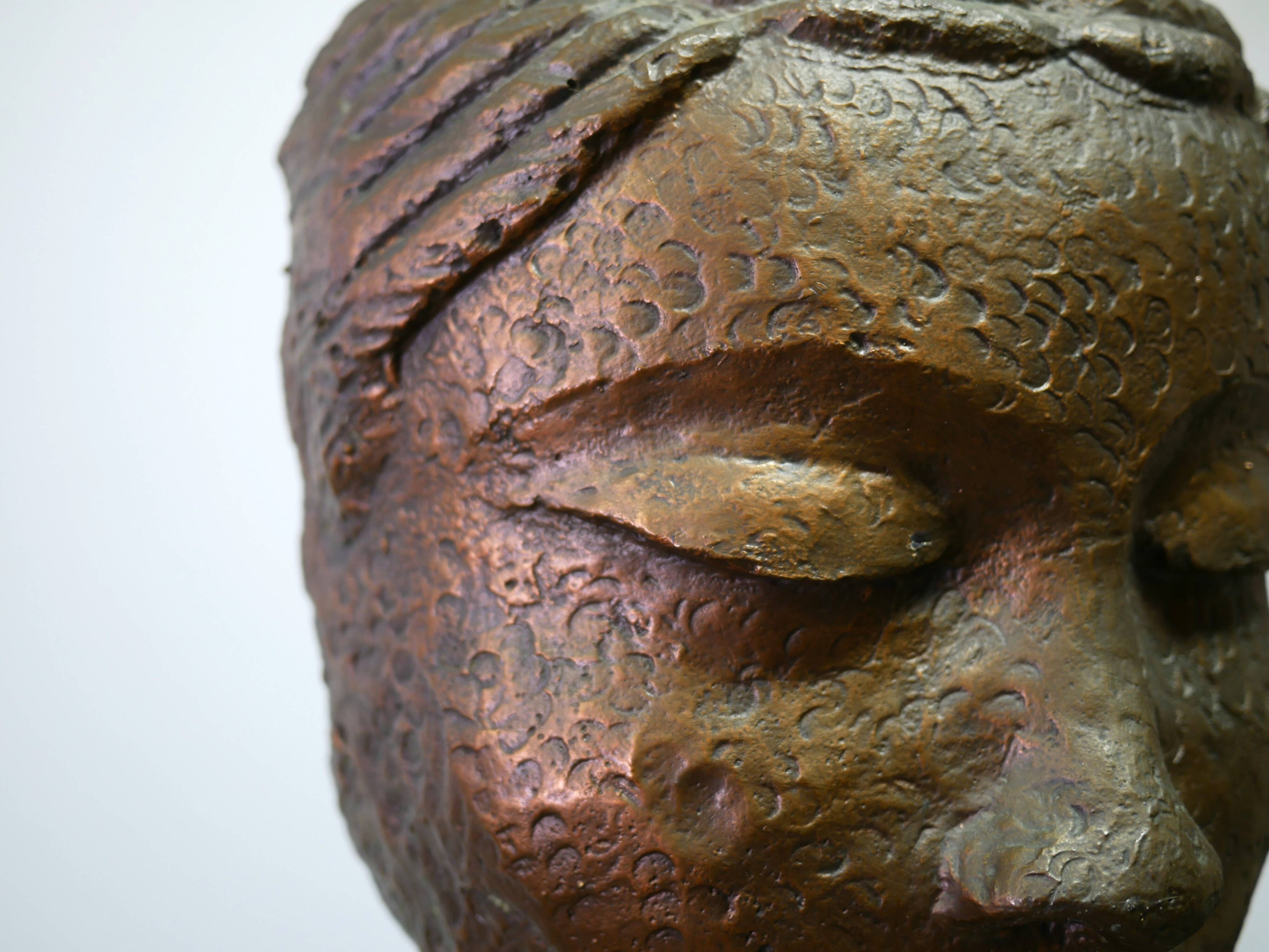 Buddha head sculpture, marble base
