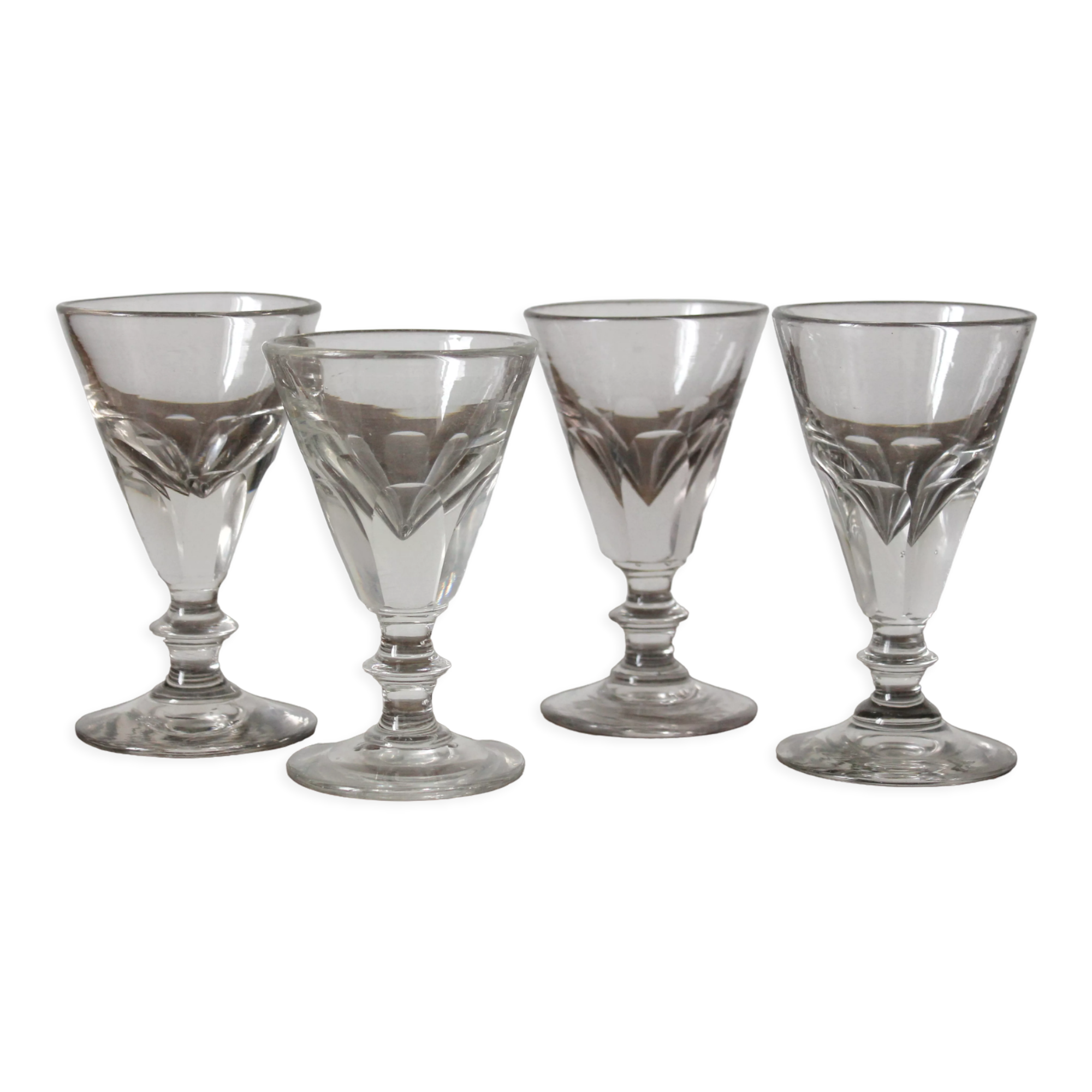 4 antique stemmed wine glasses with flat sides, made of blown glass from the 19th century