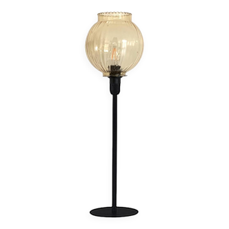 Table lamp with an antique gold glass lampshade