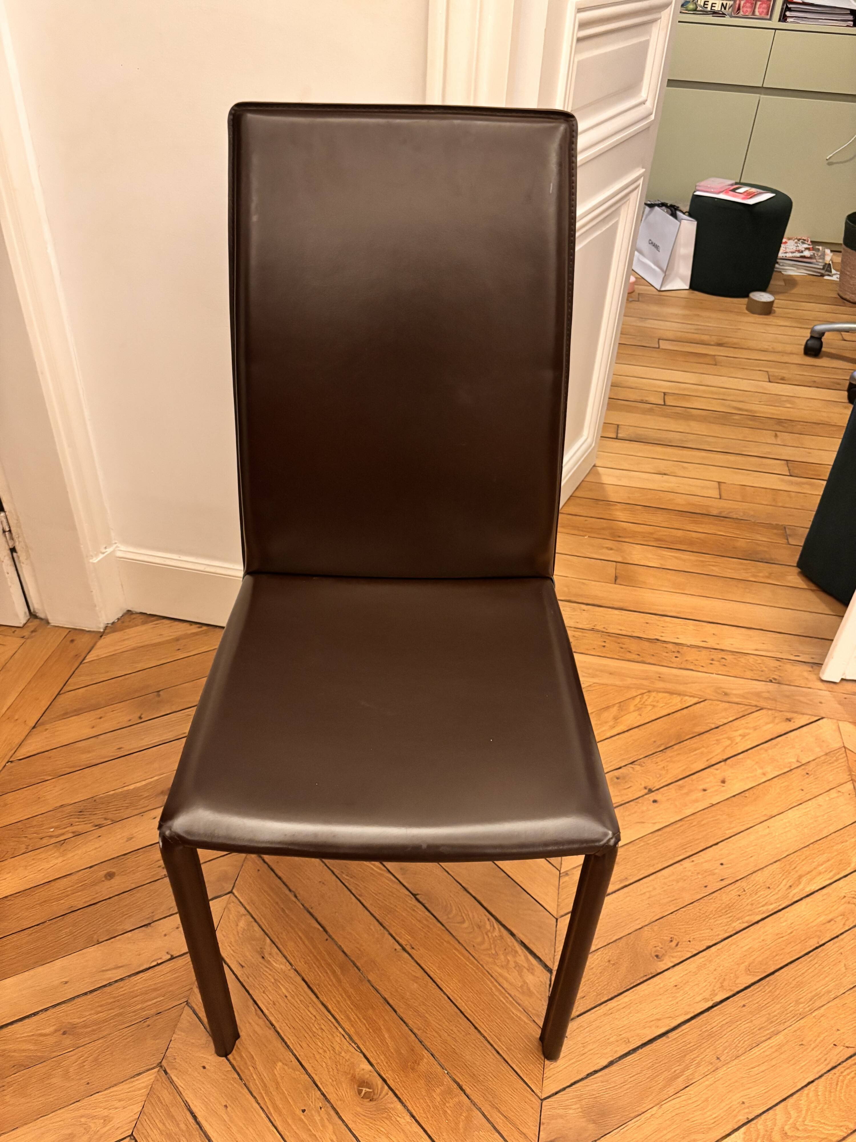 Many brown leather chairs "Roche Bobois"