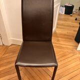 Many brown leather chairs "Roche Bobois"