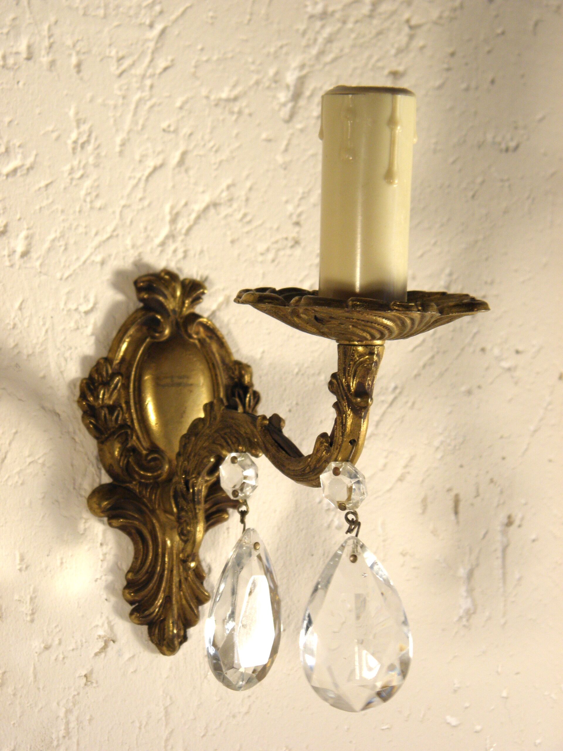 Pair of wall clams in gilded bronze stamps