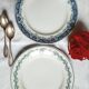 Old mismatched iron earthenware dessert plates accompanied by a dish