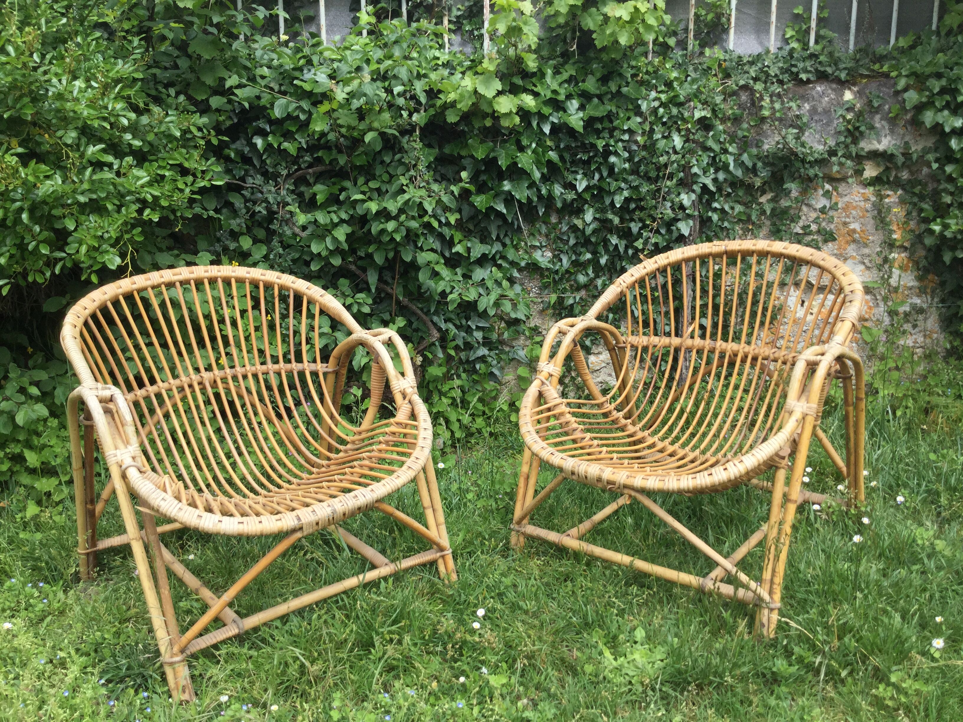 A pair of rattan armchairs
