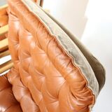 Upholstered leather armchairs 70s