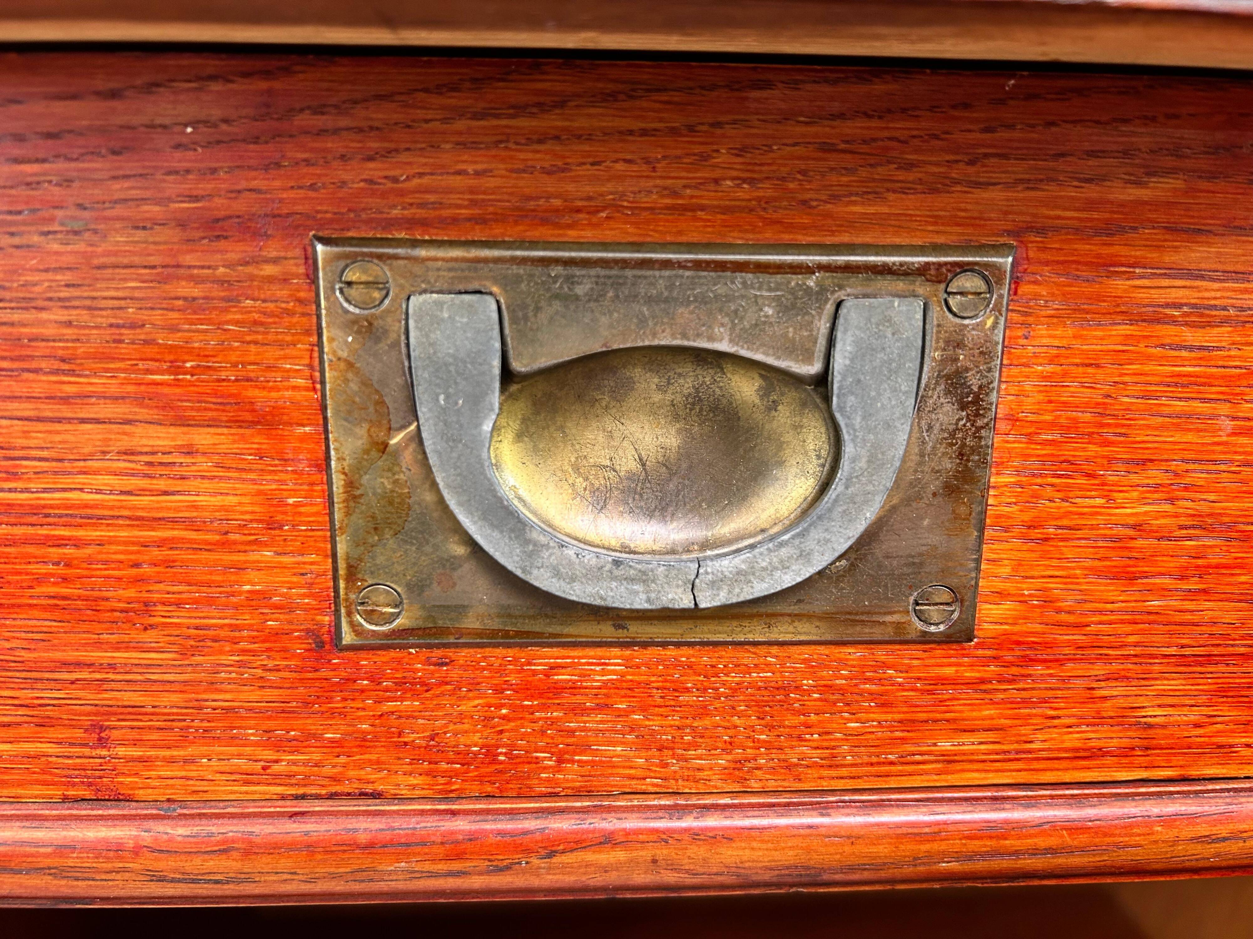 Art Nouveau cabinet with a shelf featuring distinctive floral sculptures.