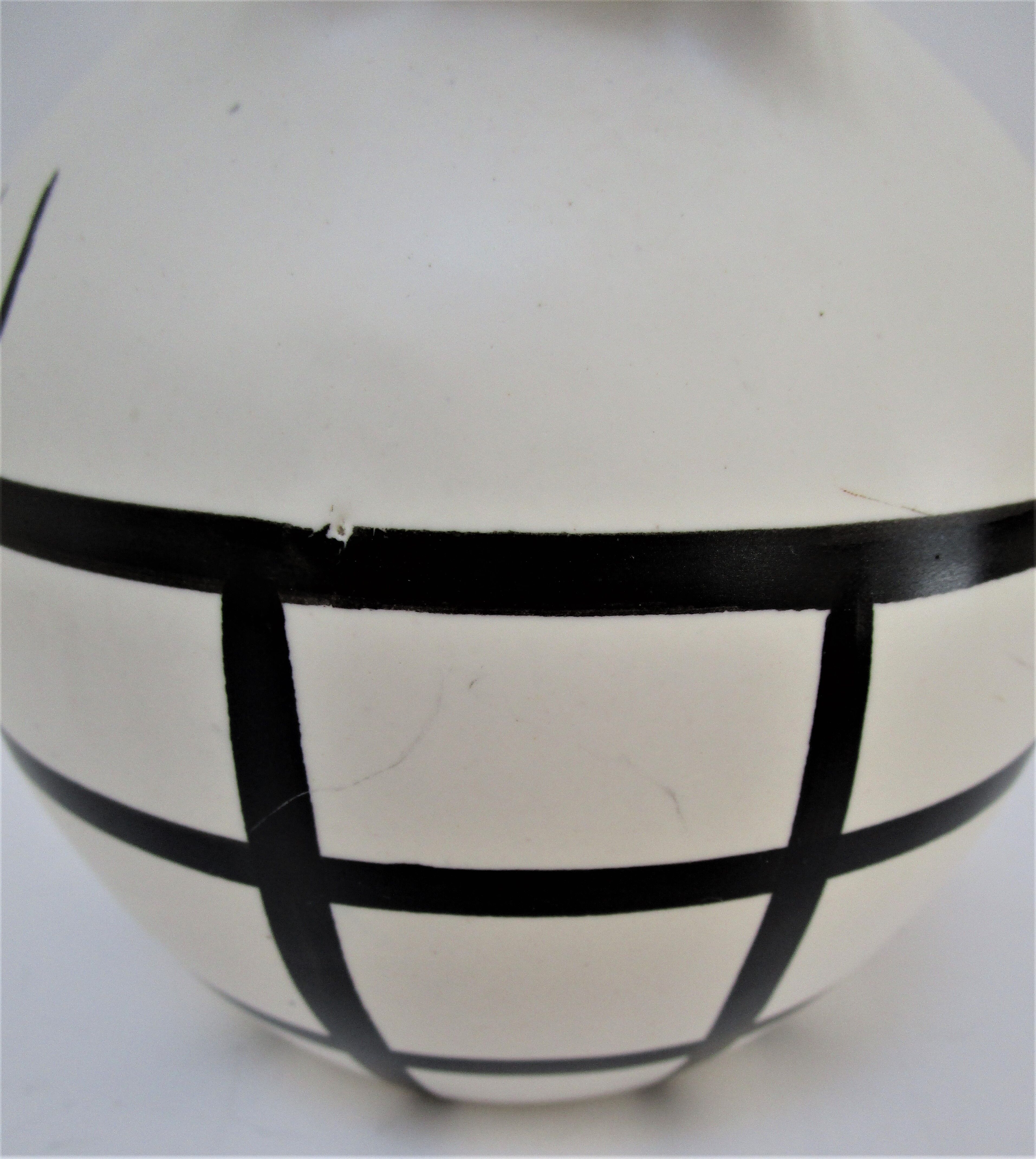 pineau bottle and ceramic cup by Lili Voltz 60s