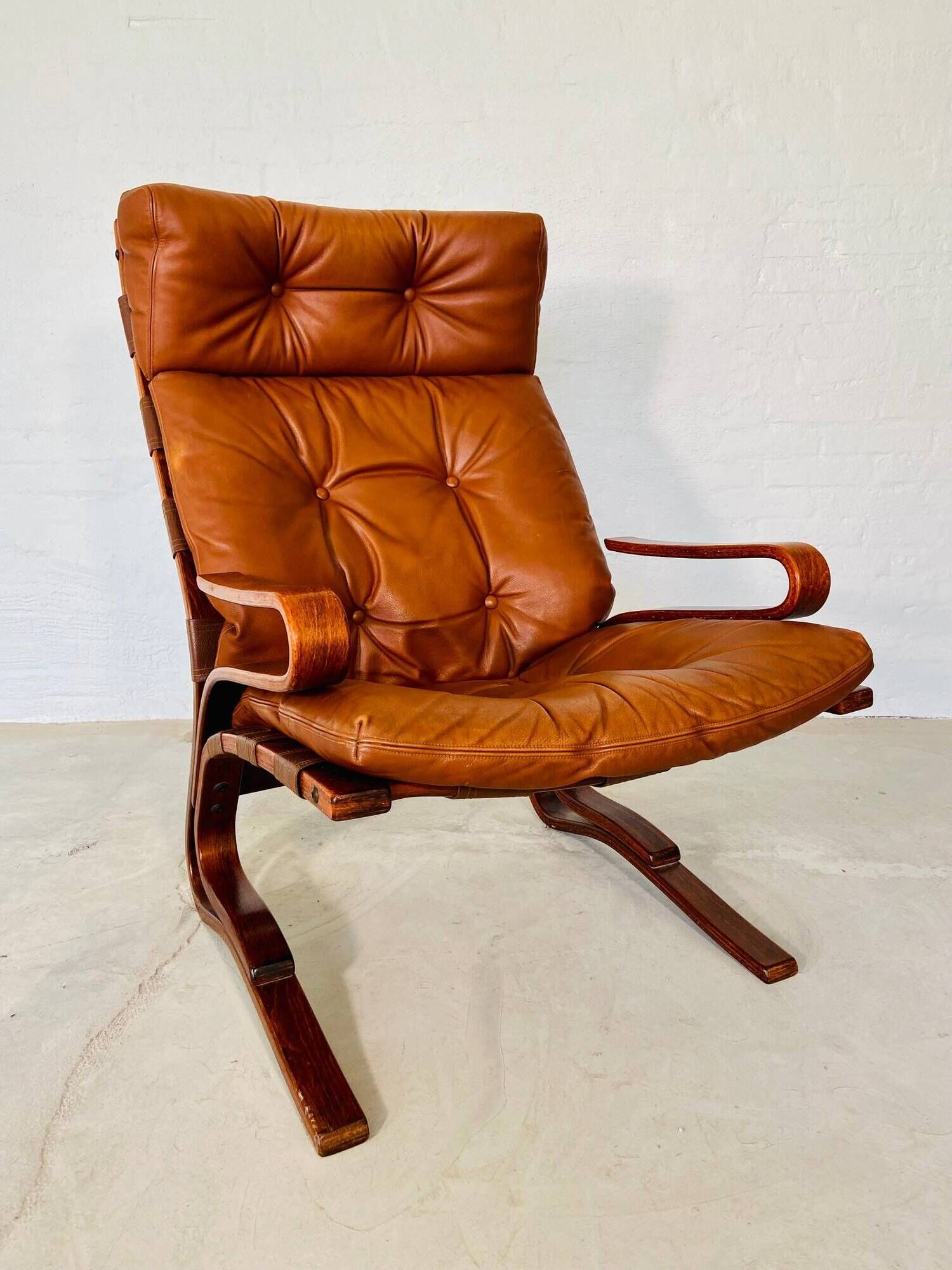 Vintage scandinavian cognac lounge chair by oddvin rykken 1960s