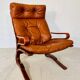 Vintage scandinavian cognac lounge chair by oddvin rykken 1960s