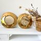 Round mirrors strapping in vintage gilded brass
