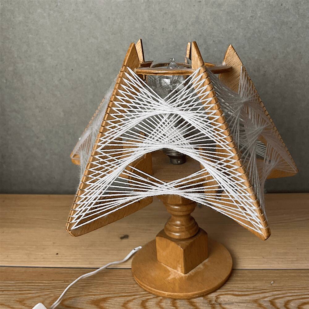 Geometric wood and string-art table lamp