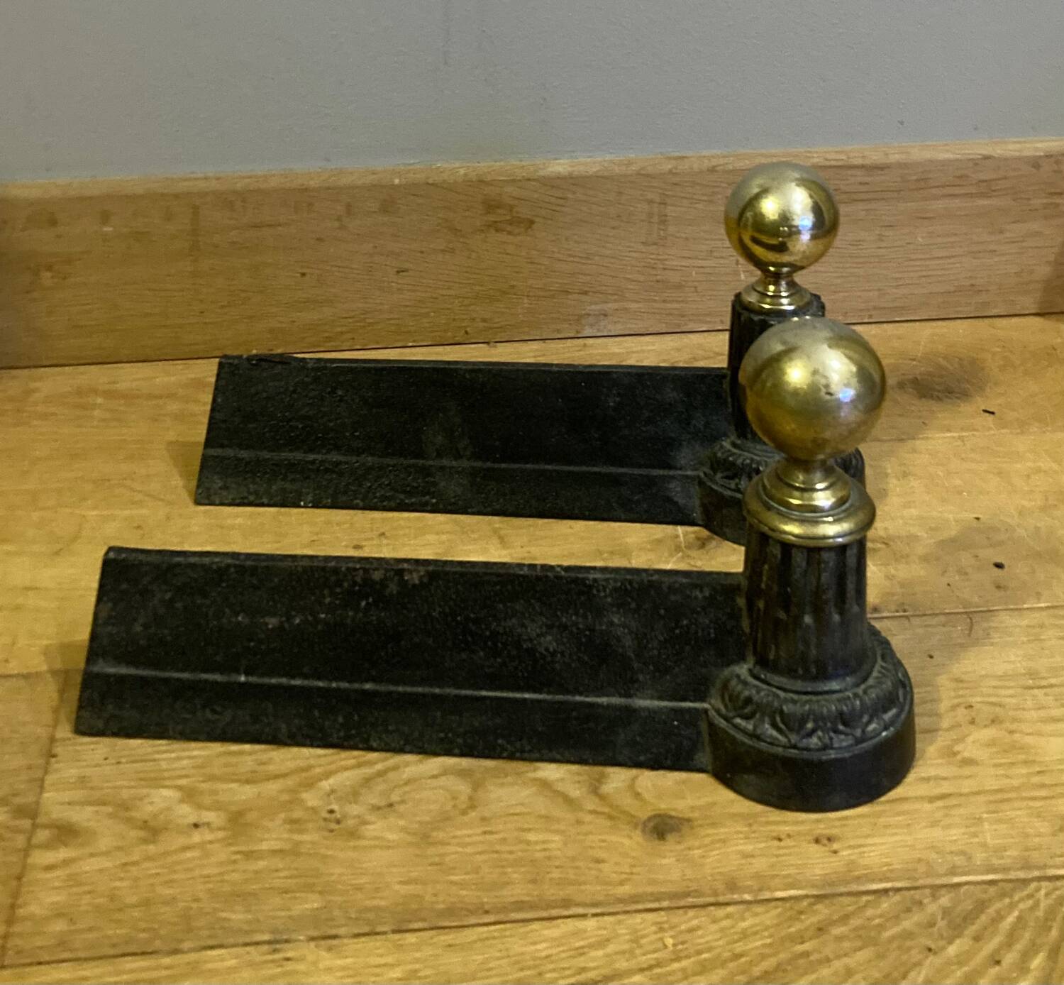 Pair of Napoleon III andirons from the 19th century in cast iron and brass
