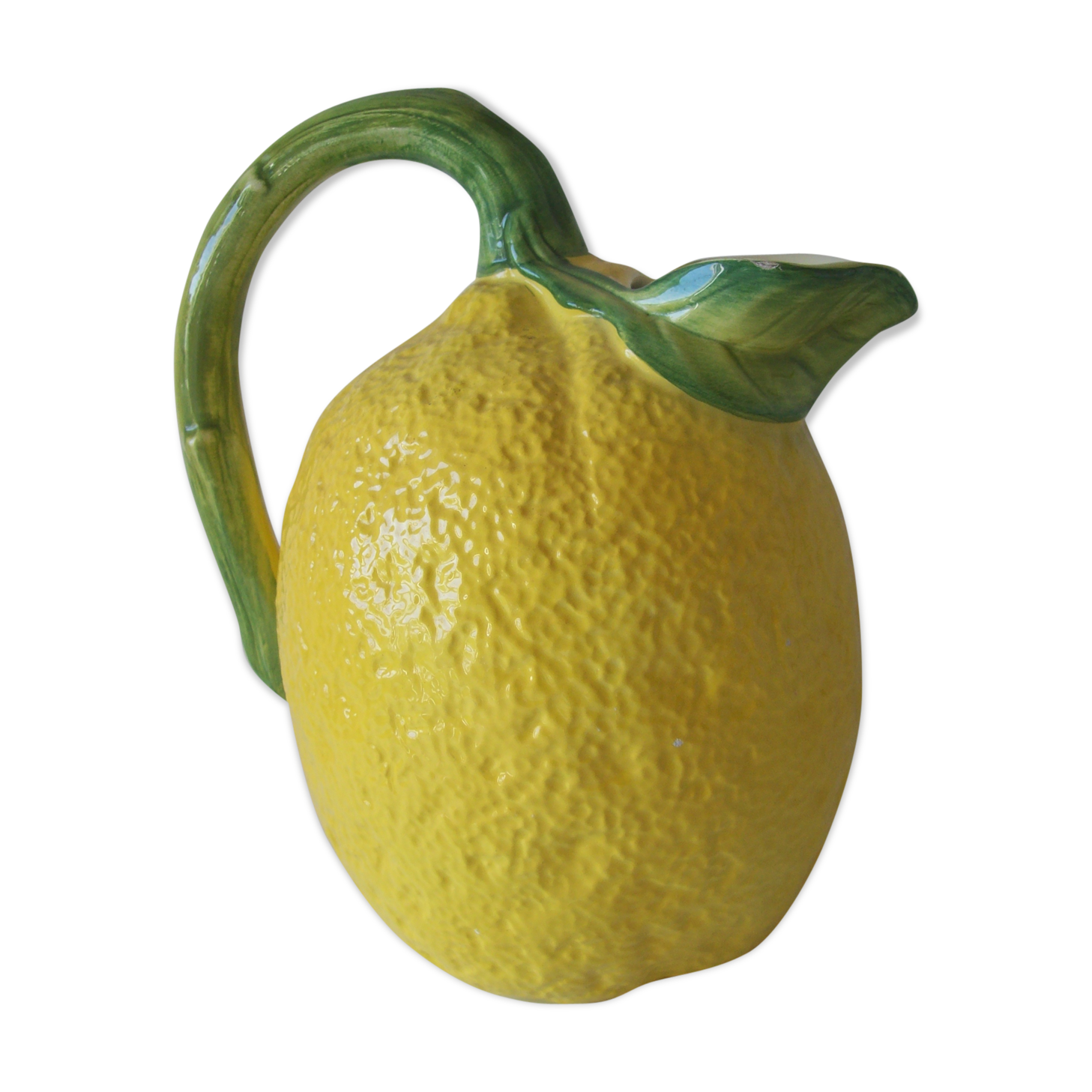 Vintage pitcher has form of lemon