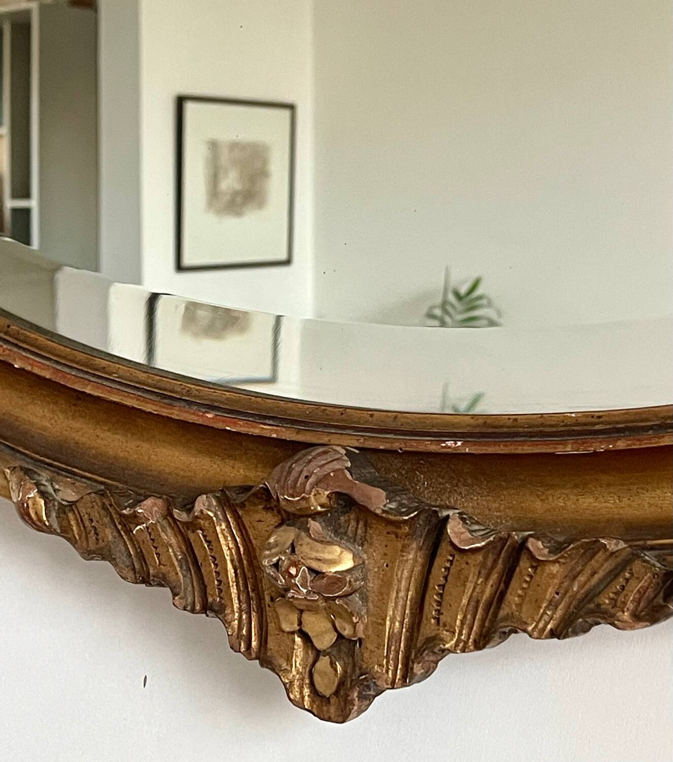 Antique oval gilt mirror.