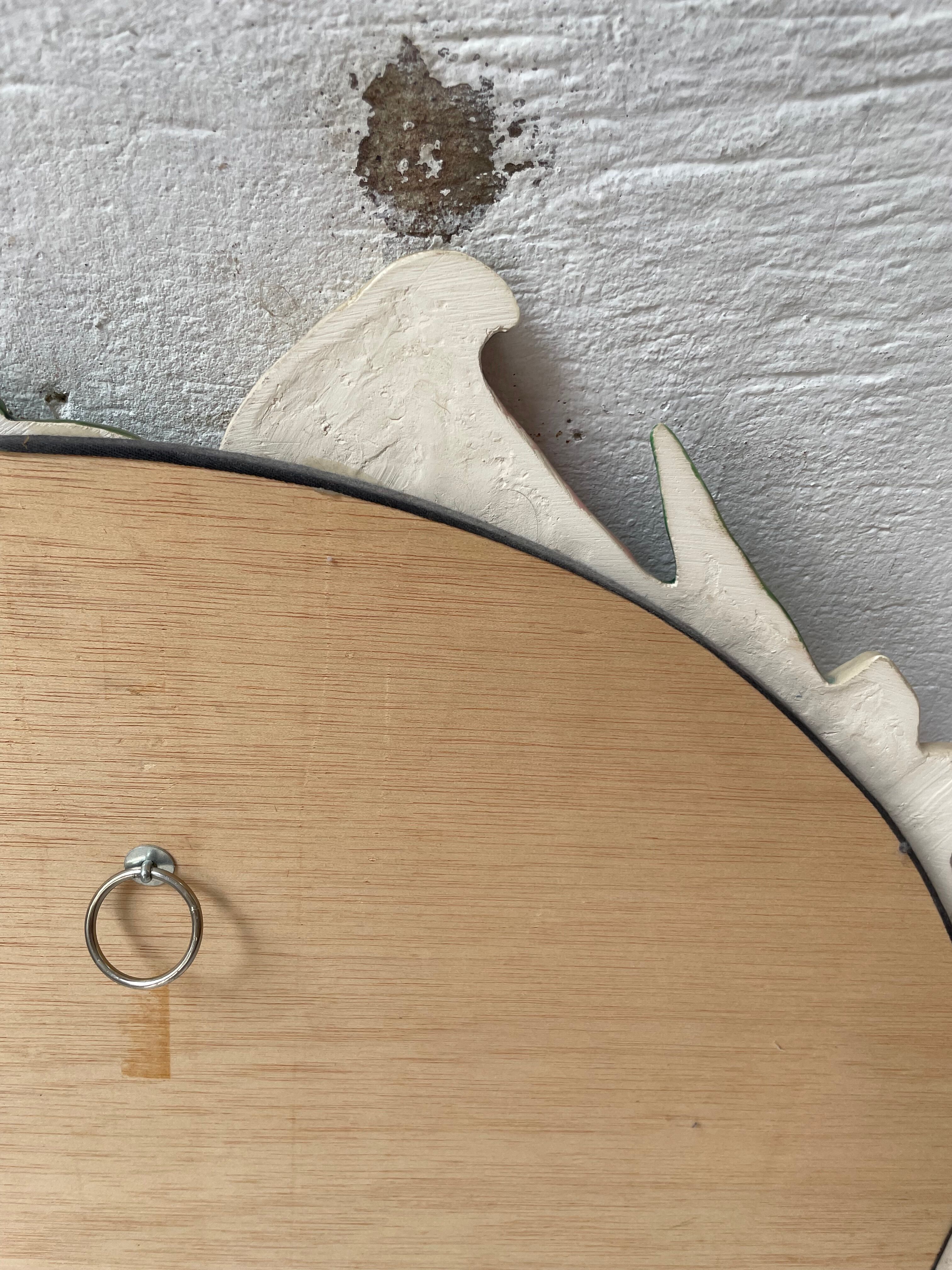 Oval ceramic mirror with flowers