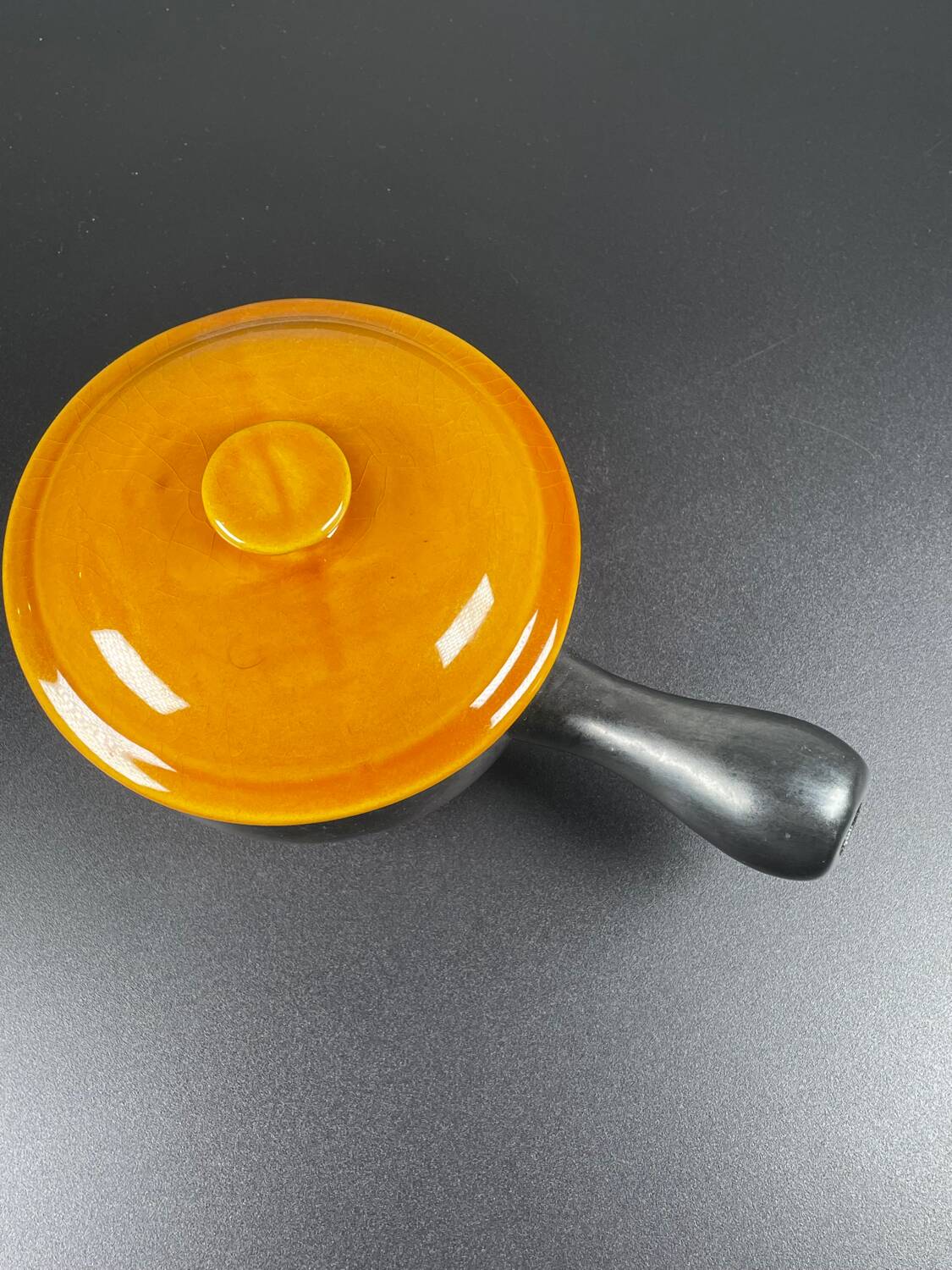 Black and yellow fondue pot