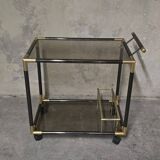 Black metal and brass rolling dessert trolley, smoked glass, 1970s.