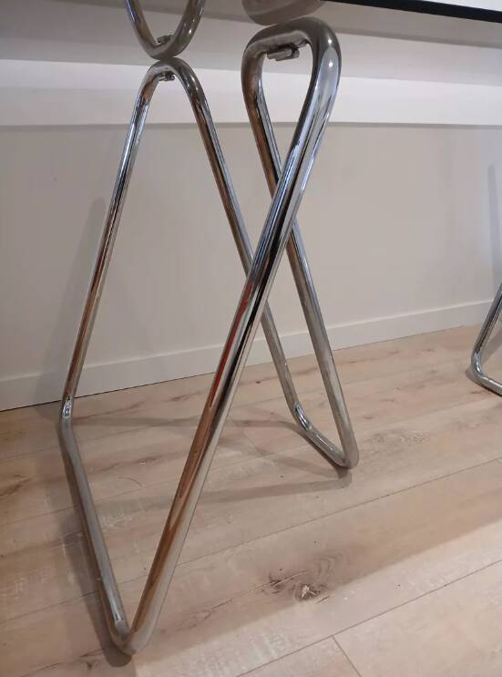 Smoked glass desk on tubular chrome trestles, 1970s design.