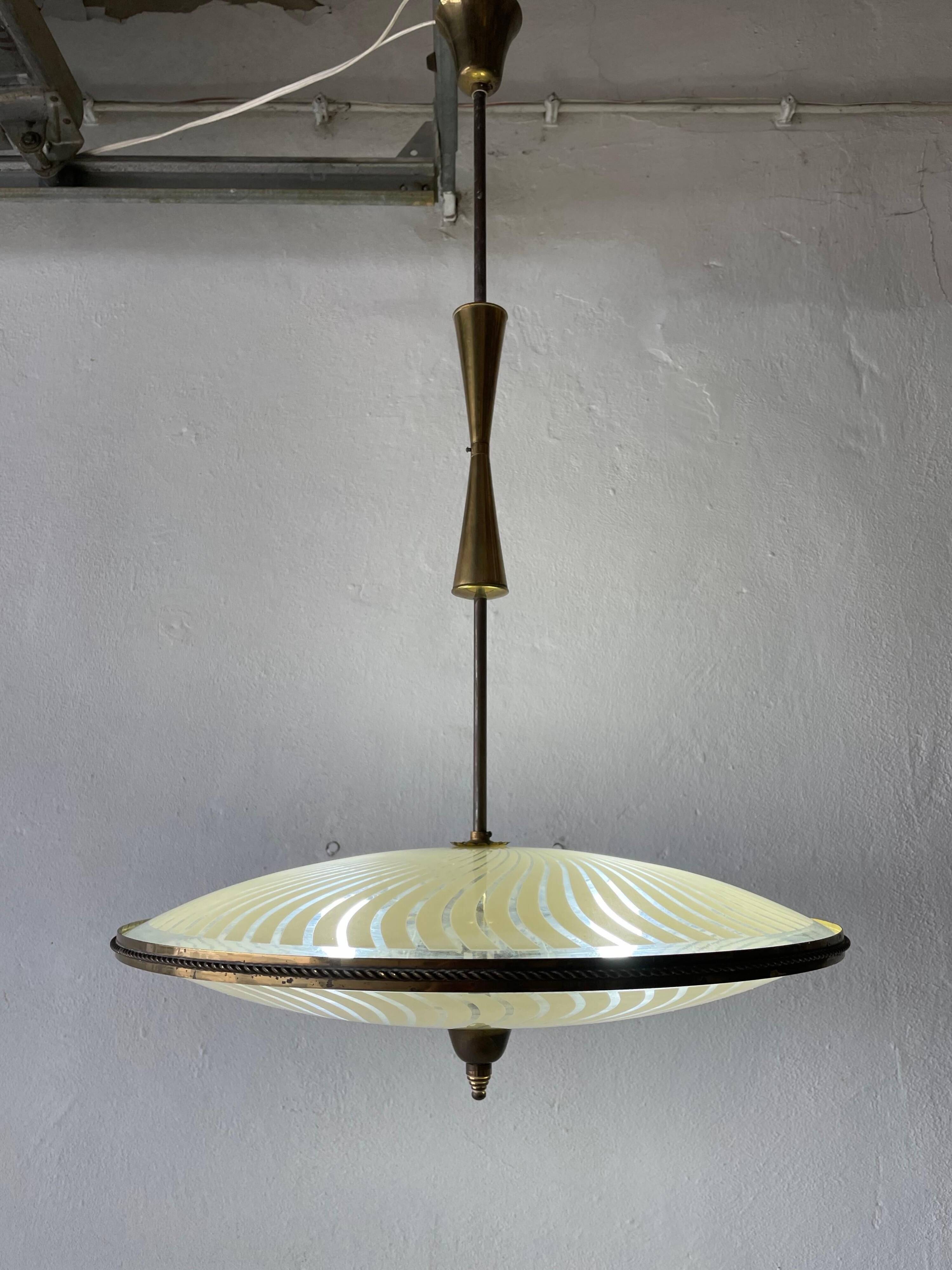 Large UFO design ceiling light in brass and printed glass, 1950s, Italy.