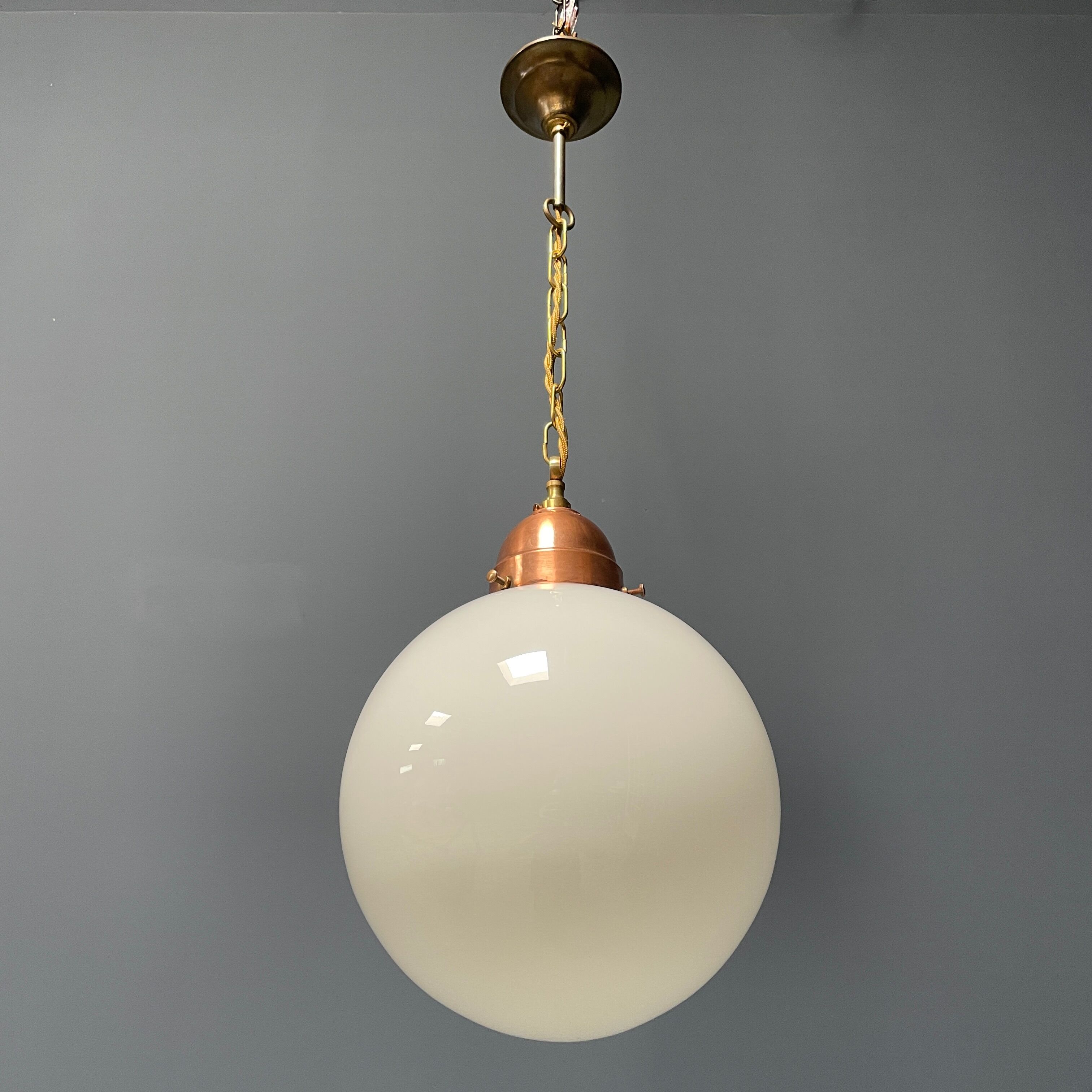 Opaline glass ball hanging lamp with copper fixture