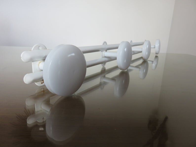 White metal coat holder in 70s
